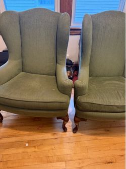 2 green wingback chairs