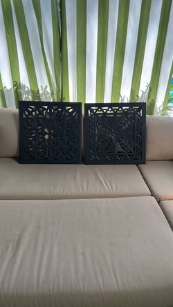 2 dark wood wall decorations