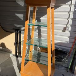 Wooden shelf with glass shelves