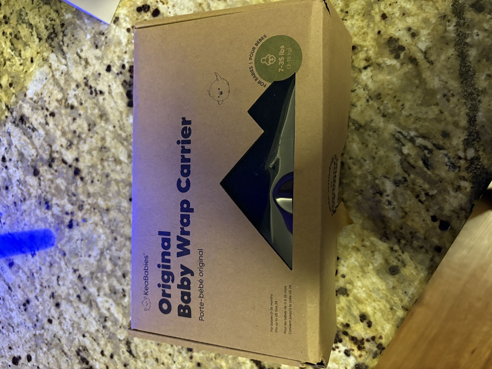 OPENED, NEVER USED BABY CARRIER WRAP.