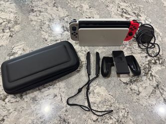 Nintendo Switch Oled + carry case + games