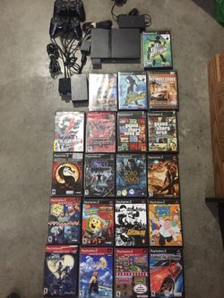 PlayStation 2 slim with accessories and games
