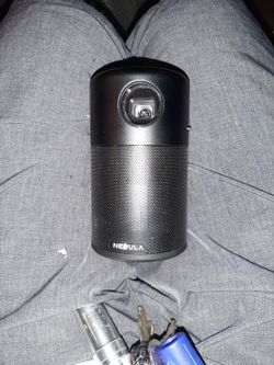 Anker NEBULA Capsule, Smart Wi-Fi Mini Projector, 100 ANSI Lumen Portable Projector, 360° Speaker, Movie Projector, 100 Inch Picture, 4Hr Video Playti