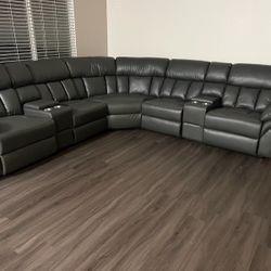 New Reclining Sectional.  Grey Gel Leatherette.  123” X 123”.  Free Delivery!
