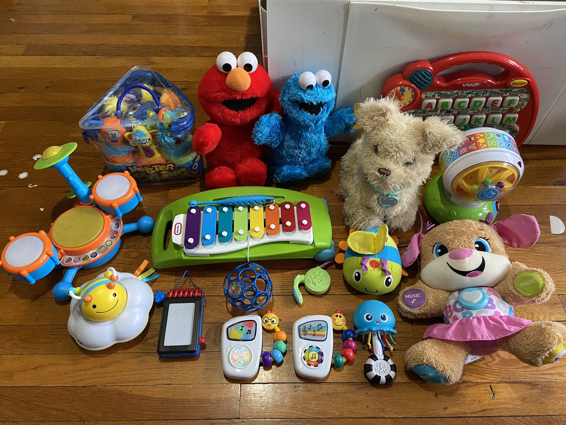 Baby toddler toy lot (elmo cookie monster talk, puppy sing and talk, fur real dog walk and talk, monster bowling set $30