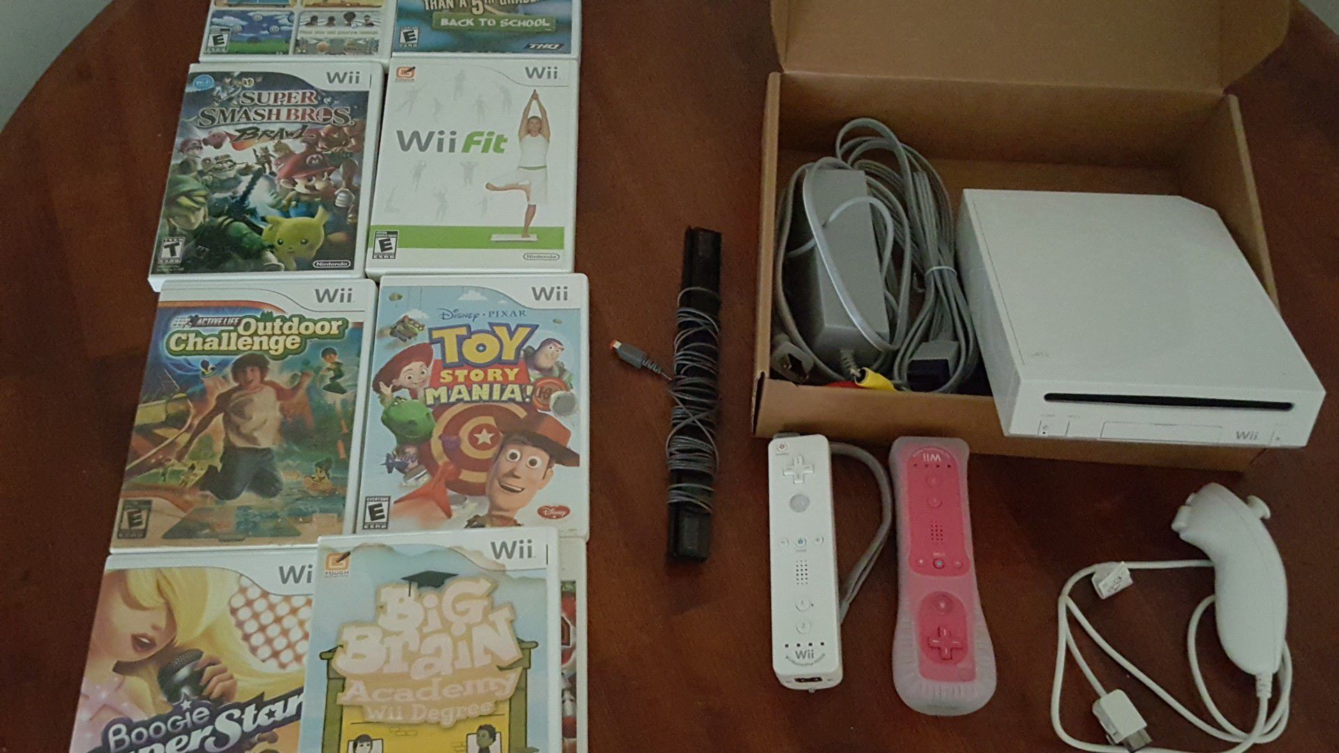 NINTENDO WII WITH ACCESSORIES AND 9 GAMES ALMOST BRAND NEW SELLING FOR $130 OBO