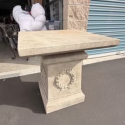 Stone pedestal table