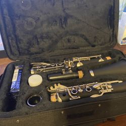 Clarinet With Case, Multiple Un-opened Reeds And Other Accessories.