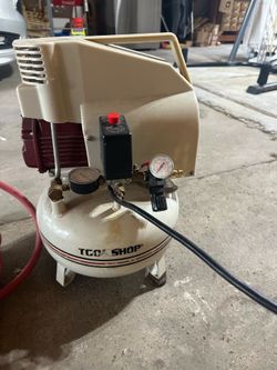 Tool Shop 2 HP 4-gallon air compressor with a beige pancake tank
