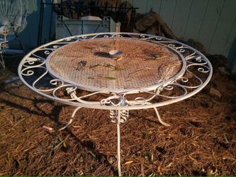 Metal iron table and 4 chairs $250