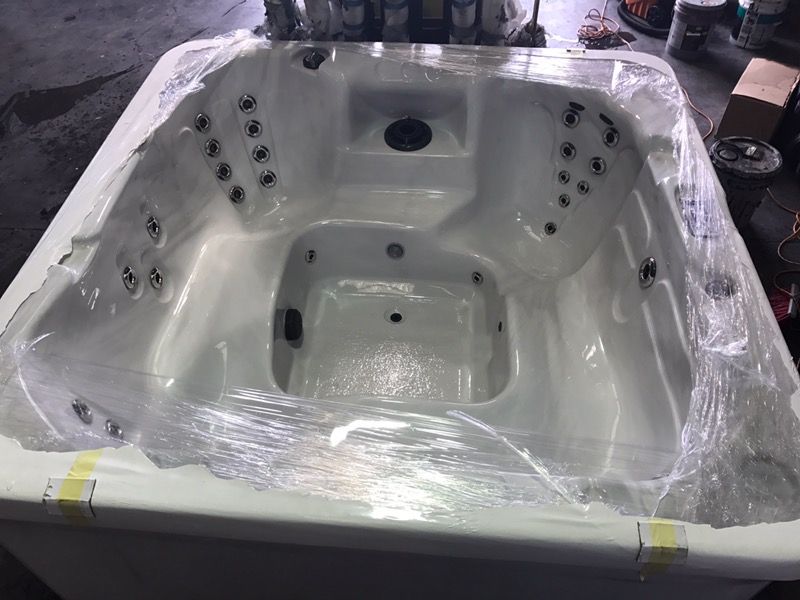 Hot tub spa. Still in wrapper. 7-8 seats, mood light, 10 yr warranty
