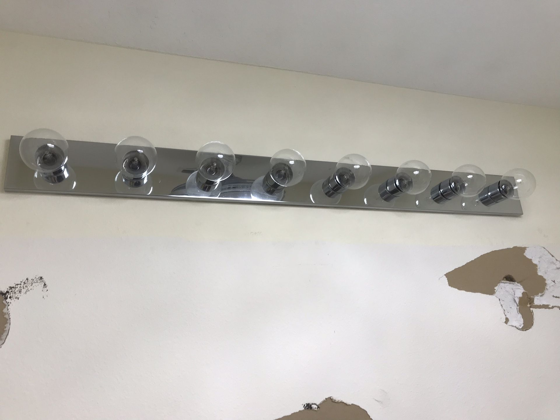 This is an 8-light fixture and other fixture is a 4-light fixture - complete with 12 clear globe bulbs.