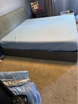 Grey cloth headboard and bed frame