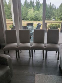 6-Grey fabric dining chairs. 2 still in the box brand new. Located in Lakebay past Gig Harbor