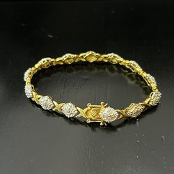 Vintage OTC 925 Sterling gold plate Diamond Chip Accent X and O Tennis bracelet