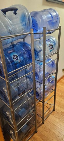Two water jug racks with 10 empty jugs, 5 gallons
