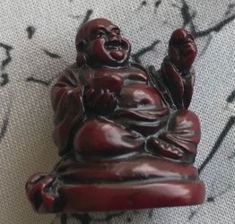 Red Resin Laughing Buddha Figurine.