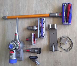 Clean Dyson V8 cordless stick vacuum with all accessories