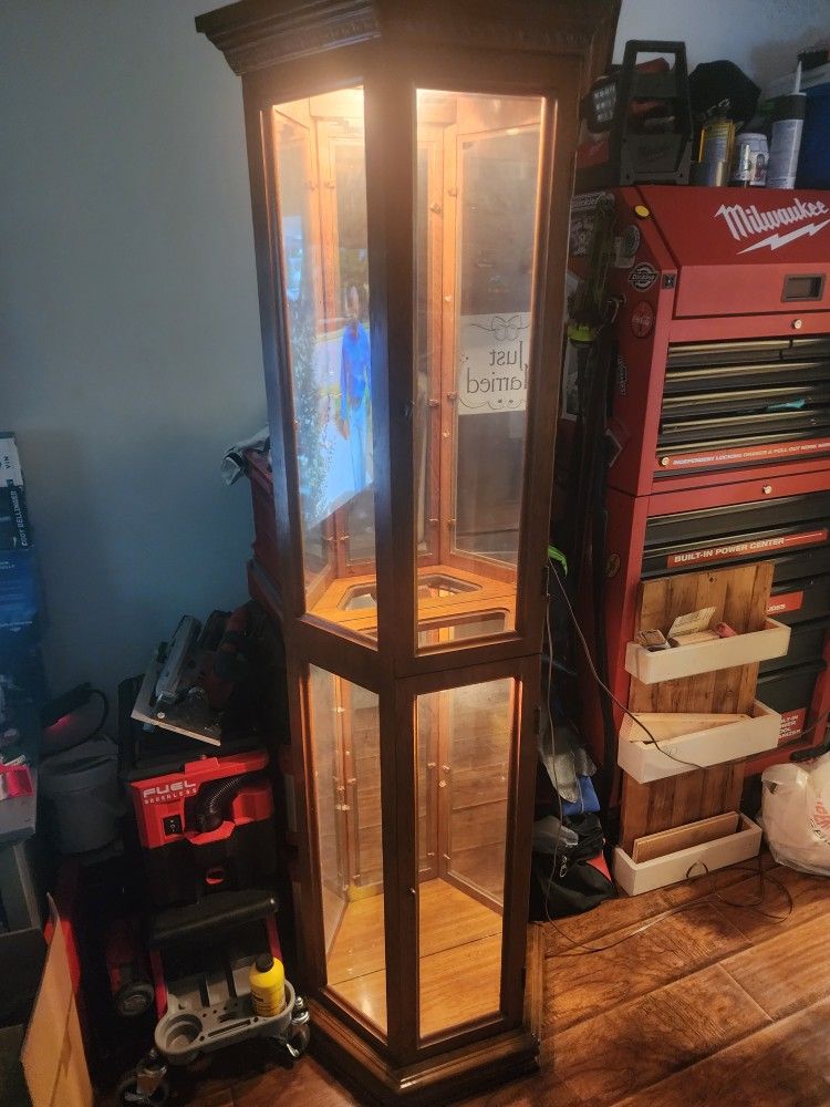 Curio Cabinet. Well Made & In Excellent Condition. Has 4 glass shelves $50.00 . Can Deliver For Small Fee$$