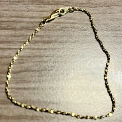 Classic gold bracelet for everyday elegance. Lightweight design with polished gold-tone beads for subtle shine. Perfect alone or layered with other ne