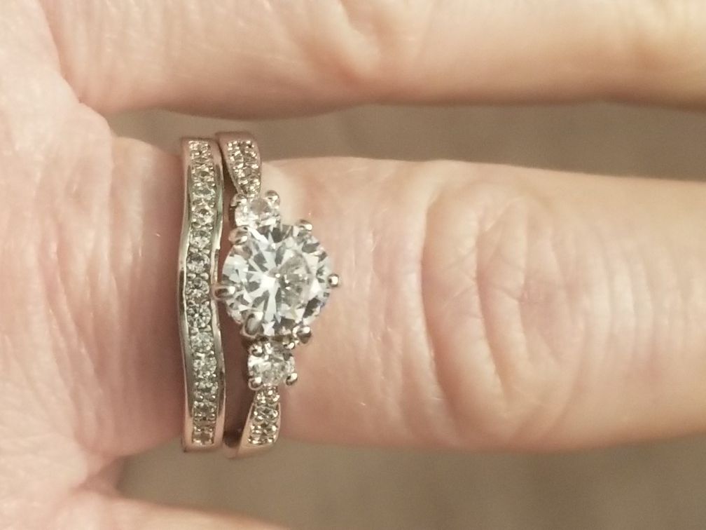 Stainless steel wedding set with white cz's size 9.