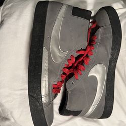 Nike Blazer High sneakers in the Cool Gray colorway.