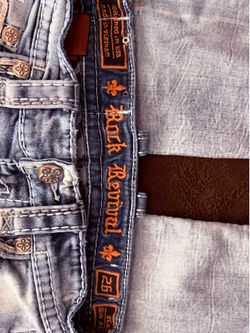 light blue rock revival jeans