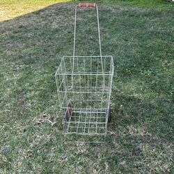 Vintage foldable, Two-wheeled shopping cart.