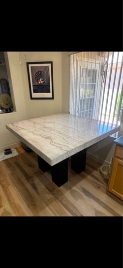 54”54” marble table. Has damage. Best offer
