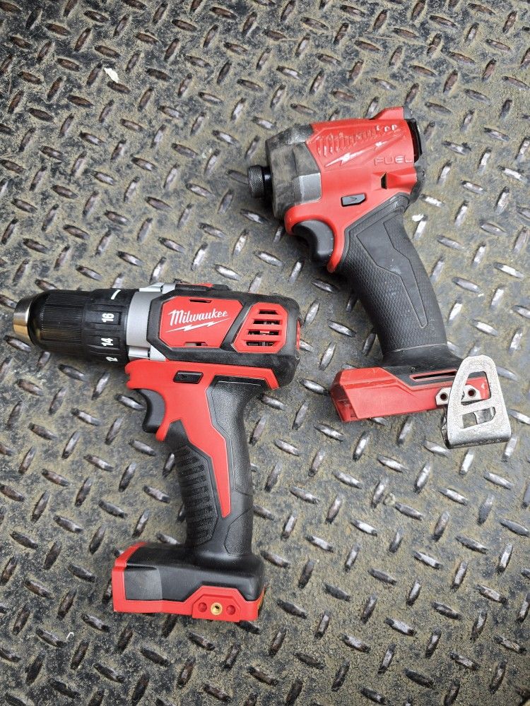 Milwaukee m18 cordless fuel impact driver and compact drill driver.