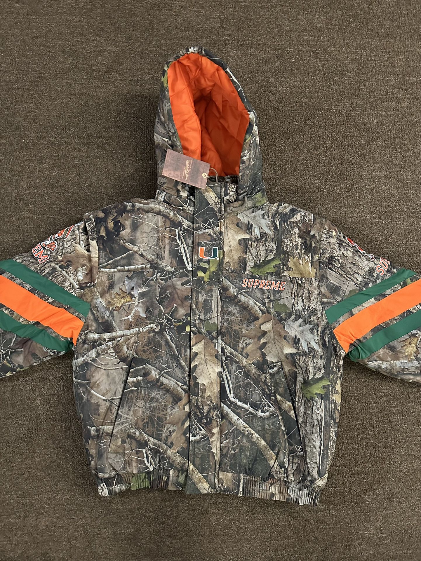 Supreme Mitchell & Ness NCAA Hooded Stadium Jacket Woodland Camo SMALL