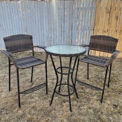 3 Piece patio set with glass top table and wicker bar height chairs