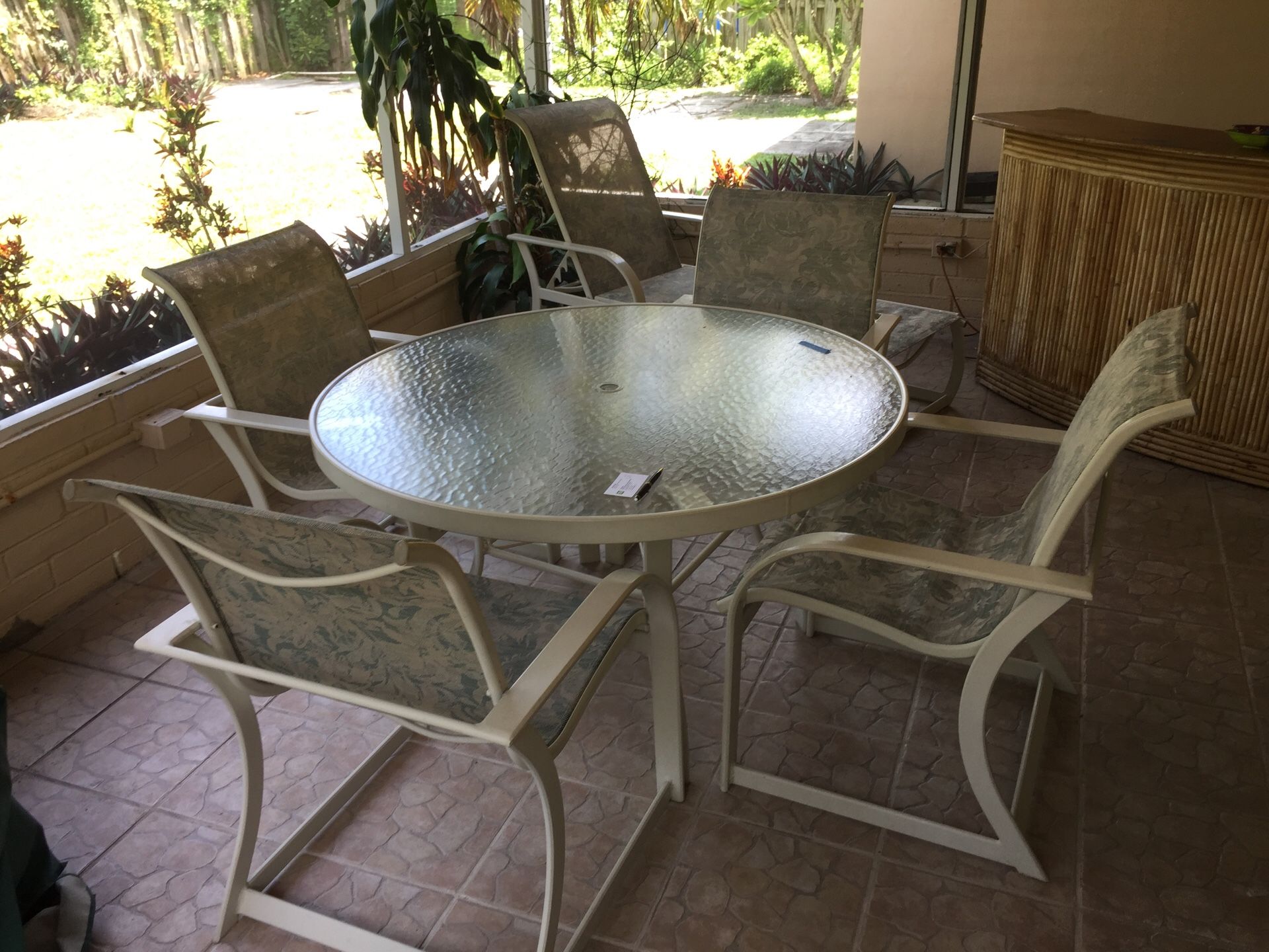 Patio set, table with 4 chairs and a chaise lounge along with a wooden