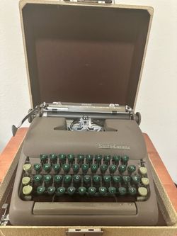 Vintage Smith-Corona Sterling Typewriter with Case & Manual
