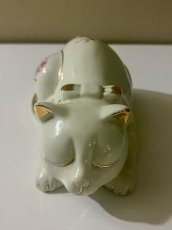 Porcelain sleeping cat figurine