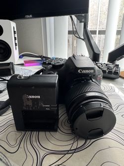 Canon EOS Rebel T100 DSLR Camera + 18-55mm Lens
