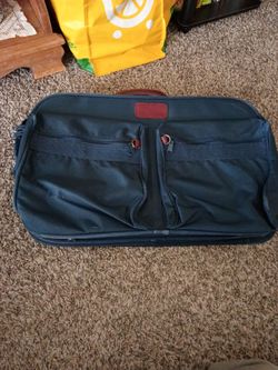 Navy Blue with red leather accents , Medium sized, In good condition