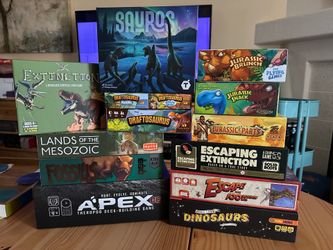 Dinosaur and prehistoric themed board games. Prices In description