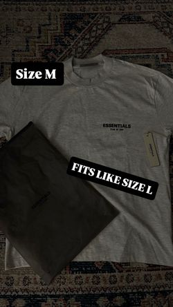 ESSENTIALS GRAY OATMEAL SHIRT SIZE M BUT RUNS SIZE LARGE