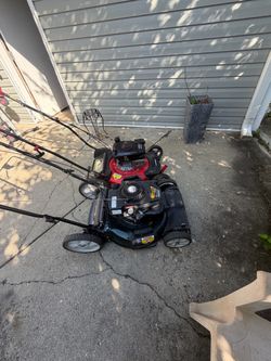 2 lawnmowers yard-man &powesmart