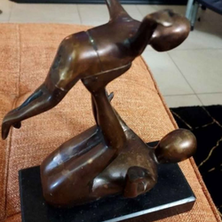 This item is an abstract bronze sculpture portraying the bond between a parent and child, often depicted as a "Leap Frog" or family scene