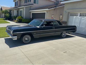 1964 Chevy Impala 350 V8 4 speed Muncy transmission M 22 4 barrel carburetor dual exhaust flow masters has been sitting inside the garage for five yea