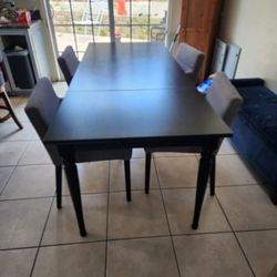 Black Table With Gray Chairs