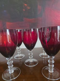 Set of five vintage ruby red wine glasses with clear segmented ball stems.