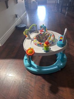 Baby walker/ activity center and baby sit up chair..