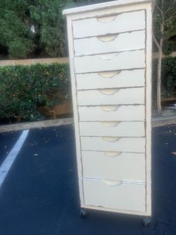 Cream colored Wheeled dresser