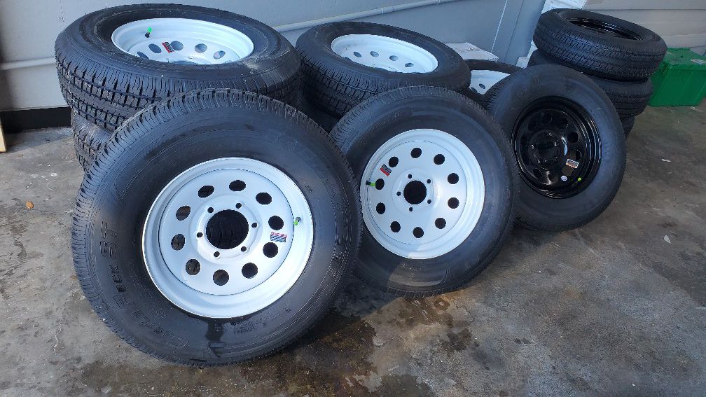 Brand new trailer tires with the rims.