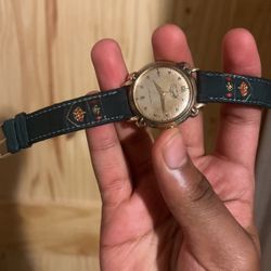 Gold and green benrus