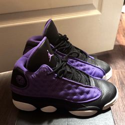purple and black air jordan sneakers.