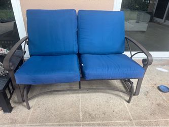 Love seat rocking chair with blue cushions
